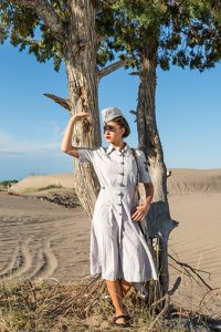 Young military nurse shades her eyes from the desert sun